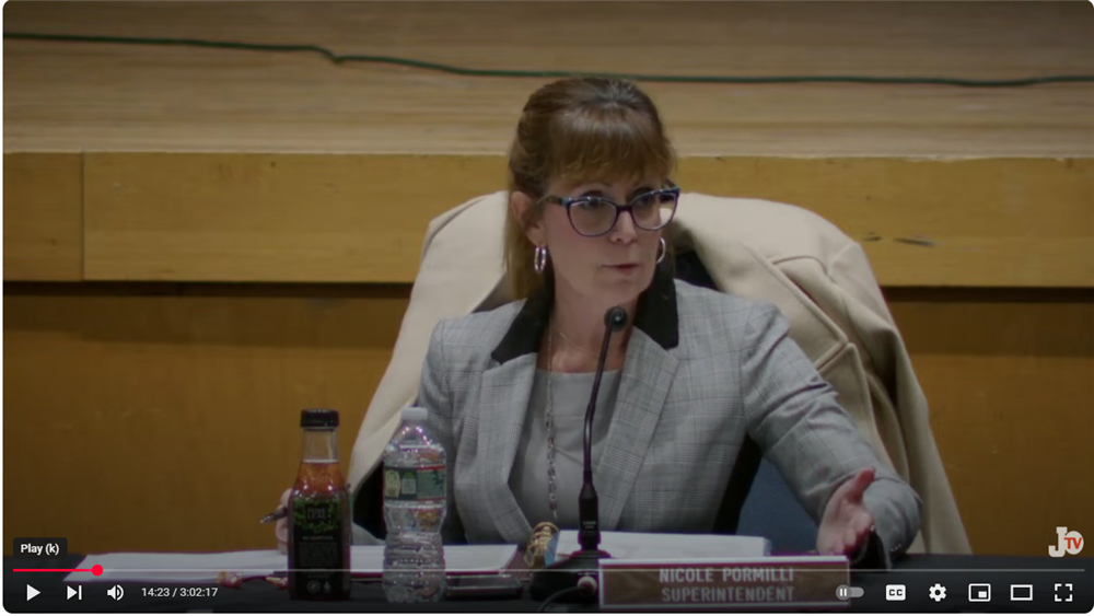  frame of video from the Board of Education meeting showing the superintendent